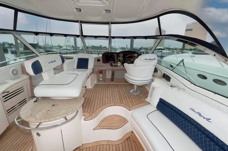 Slide: The Image of Luxurious 2005 Sea Ray 500 Sundancer yacht interior with elegant seating and helm. - 7
