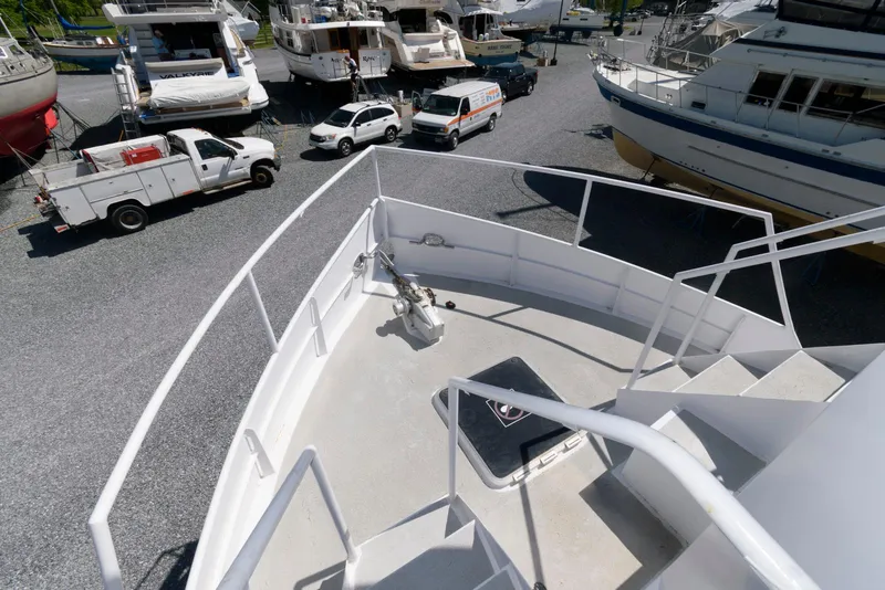 Slide: The Image of 1997 Florida Bay Coasters 35 boat on dry dock with surrounding vehicles and boats. - 11