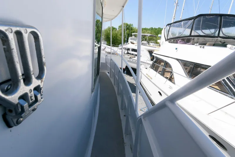 Slide: The Image of Side view of a 1997 Florida Bay Coasters 35 yacht docked at a marina. - 12