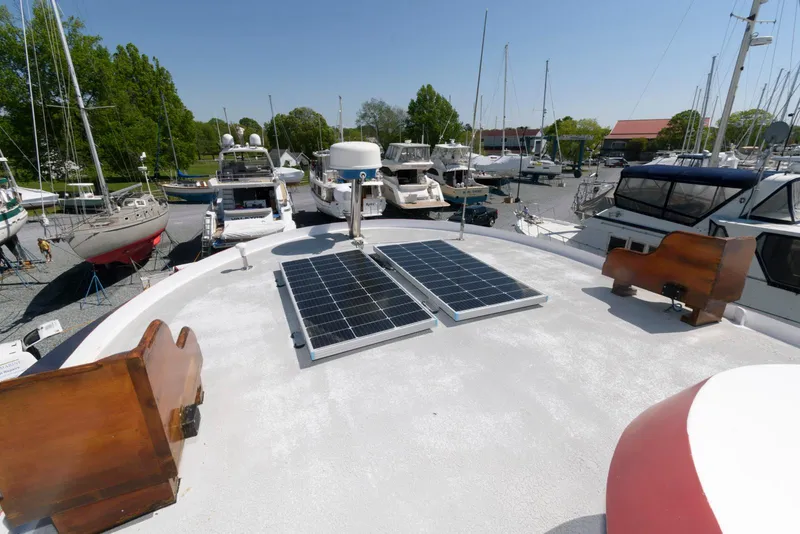 Slide: The Image of Solar panels on 1997 Florida Bay Coasters 35 boat docked at marina. - 13