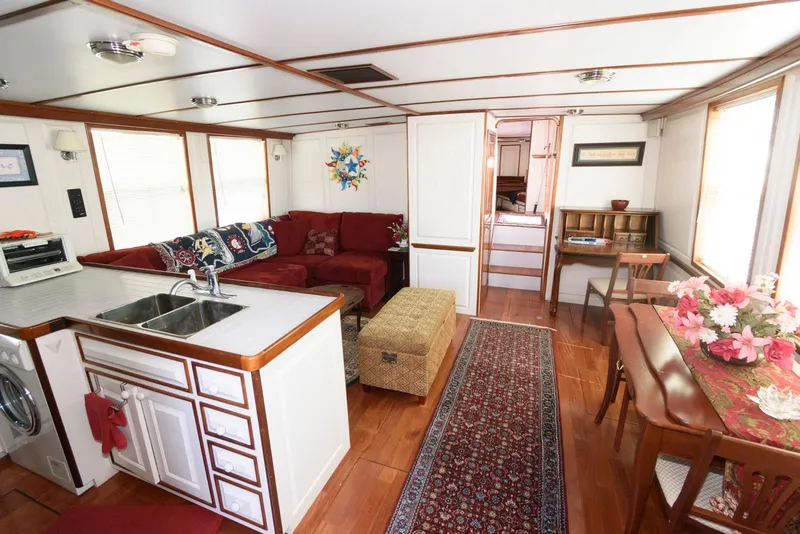 Slide: The Image of Interior of a 1997 Florida Bay Coasters 35 boat with cozy living area and kitchen. - 15