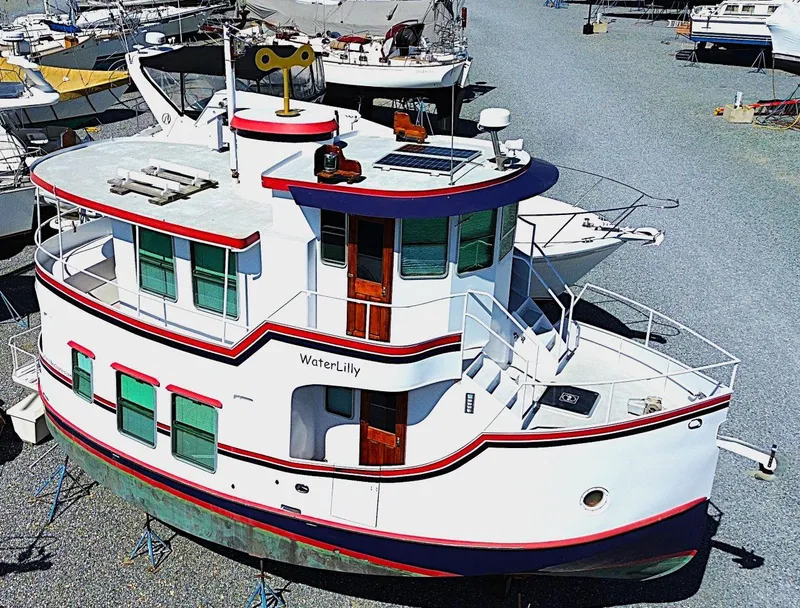 Slide: The Image of Florida Bay Coasters 35, 1997 model boat named WaterLilly, docked in a marina. - 3