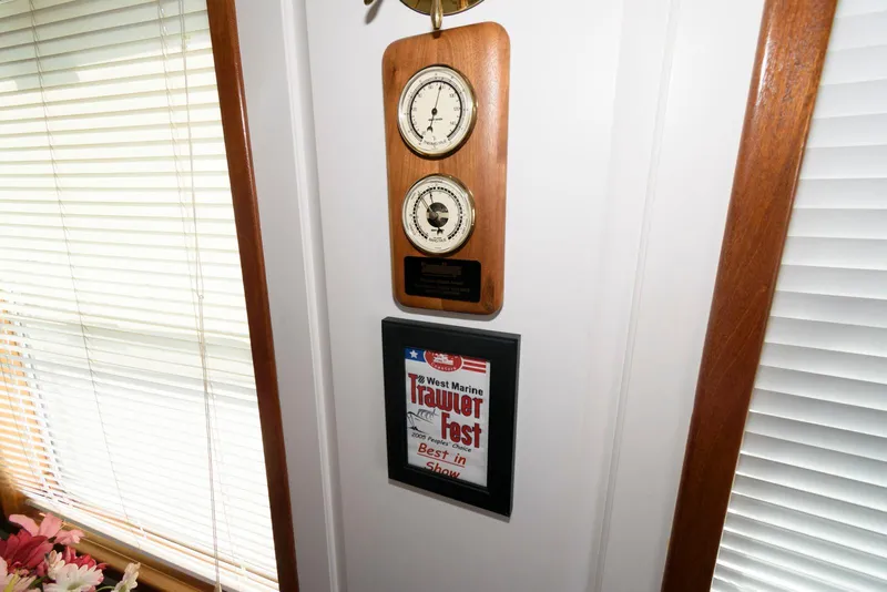 Slide: The Image of Wall-mounted barometer and framed award in a Florida Bay Coasters 35, 1997 model. - 32