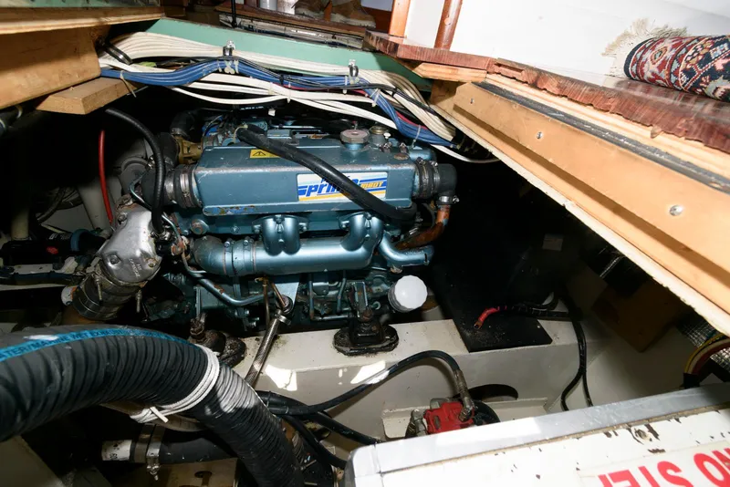 Slide: The Image of Engine compartment of a 1997 Florida Bay Coasters 35 boat, showcasing mechanical components. - 33