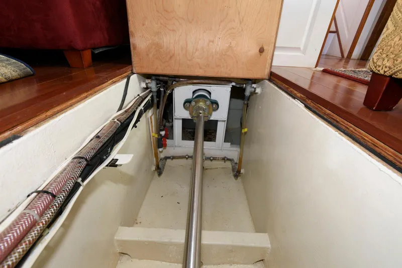 Slide: The Image of Engine compartment of a 1997 Florida Bay Coasters 35 boat, showing mechanical components and wiring. - 35