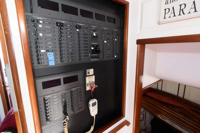 Slide: The Image of Electrical panel inside a 1997 Florida Bay Coasters 35 boat, featuring switches and controls. - 37