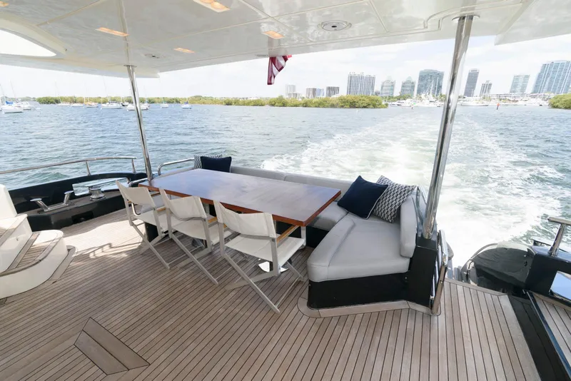 Slide: The Image of Azimut 84 Flybridge Motor Yacht 2013, spacious deck with seating, cruising on open water. - 10