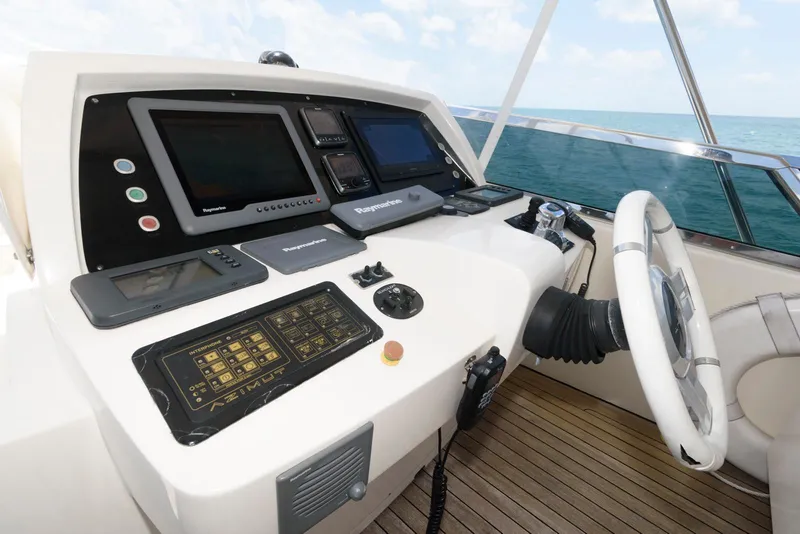 Slide: The Image of Helm of 2013 Azimut 84 Flybridge Motor Yacht with navigation controls and ocean view. - 28