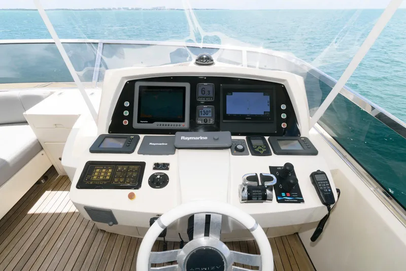 Slide: The Image of Helm of 2013 Azimut 84 Flybridge Motor Yacht with navigation equipment and ocean view. - 29