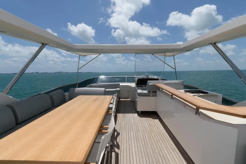 Slide: The Image of Azimut 84 Flybridge Motor Yacht 2013, spacious deck with seating, ocean view, clear skies. - 33