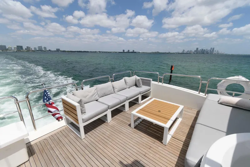 Slide: The Image of Azimut 84 Flybridge Motor Yacht 2013, spacious deck with seating, ocean view, city skyline. - 35