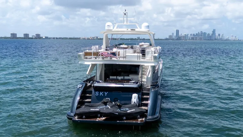 Slide: The Image of Azimut 84 Flybridge Motor Yacht 2013 on water, city skyline in background. - 5