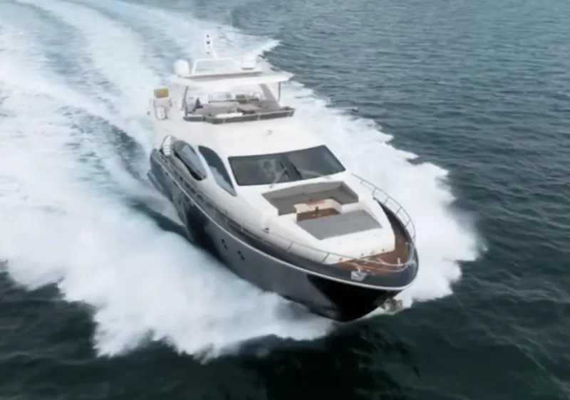 Slide: The Image of 2013 Azimut 84 Flybridge Motor Yacht cruising on open water. - 7