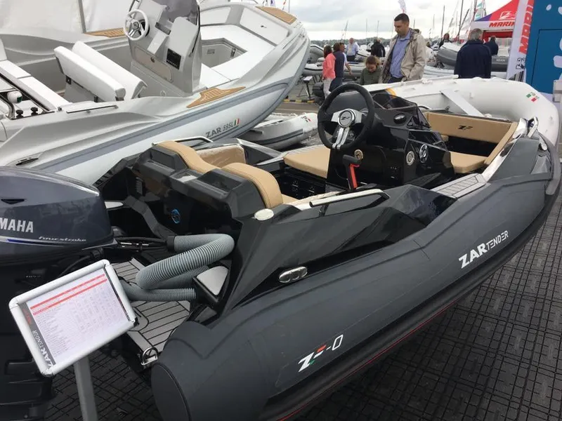 Slide: The Image of 2025 Zar Formenti ZF-0 boat with Yamaha engine, displayed at a boat show. - 2
