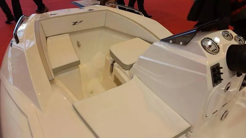Slide: The Image of 2025 Zar Formenti ZF-0 boat interior with white seating and control panel. - 8