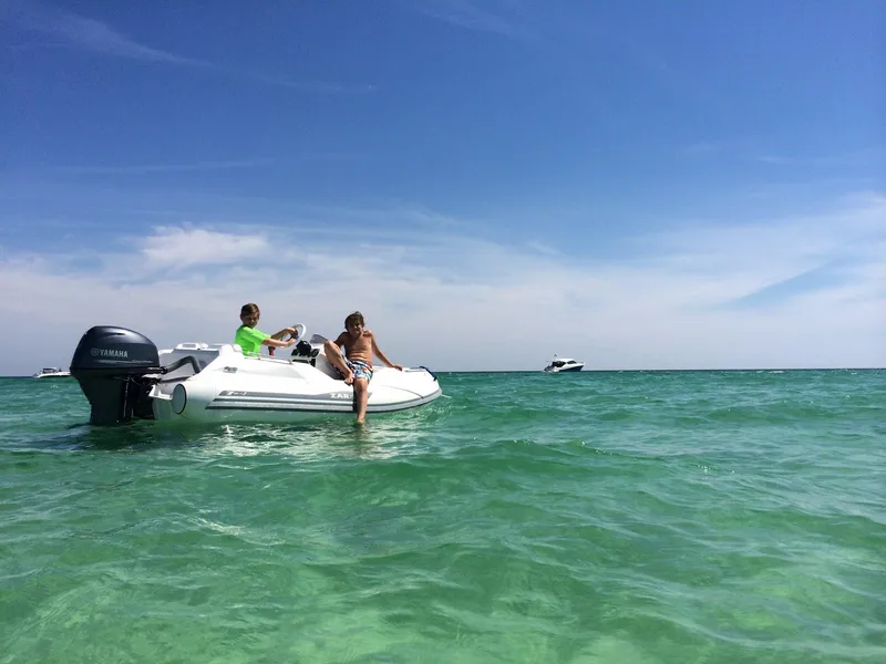 Slide: The Image of Two people on a Zar Formenti ZF-1 boat in clear blue water, 2025 model. - 11