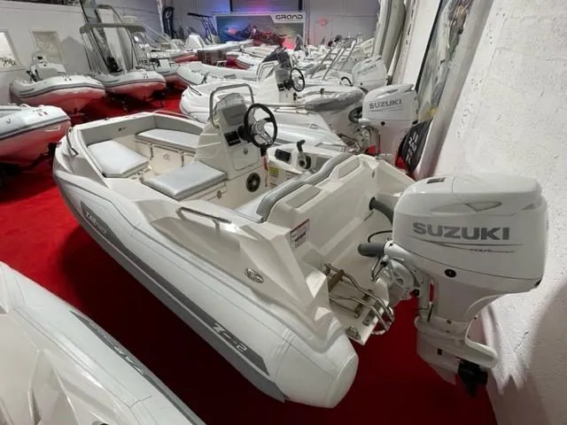 Slide: The Image of 2025 Zar Formenti ZF-2 boat with Suzuki engine on display in showroom. - 15