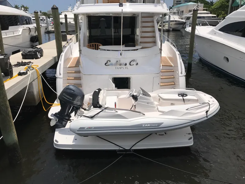 Slide: The Image of A 2025 Zar Formenti ZF-3 boat docked at a marina, featuring a sleek design. - 5