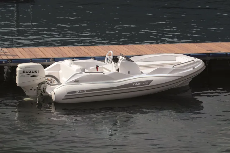 Slide: The Image of 2025 Zar Formenti ZF-3 boat docked with Suzuki outboard motor. - 6