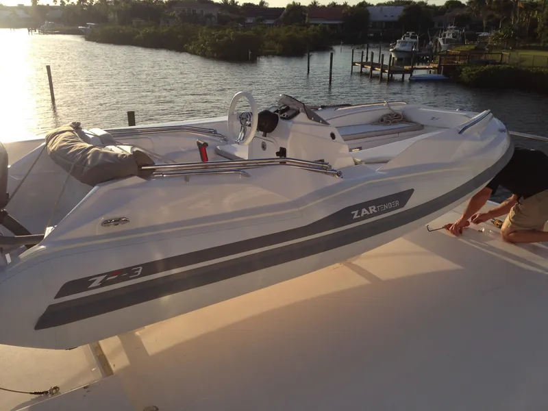 Slide: The Image of 2025 Zar Formenti ZF-3 boat docked by a scenic waterfront at sunset. - 8