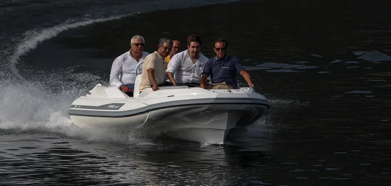 Slide: The Image of Five people enjoying a ride on a 2025 Zar Formenti ZF-3 boat. - 9