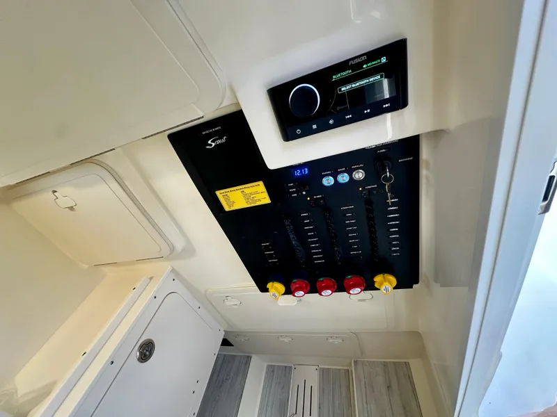 Slide: The Image of Control panel of 2025 Scout 277 LXF boat with Bluetooth system. - 12