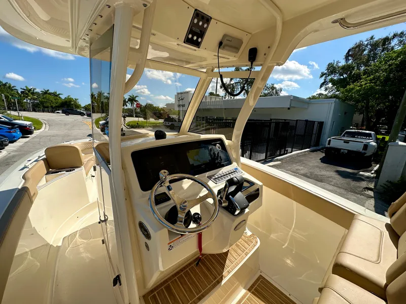 Slide: The Image of 2025 Scout 277 LXF boat interior with modern helm and seating. - 3