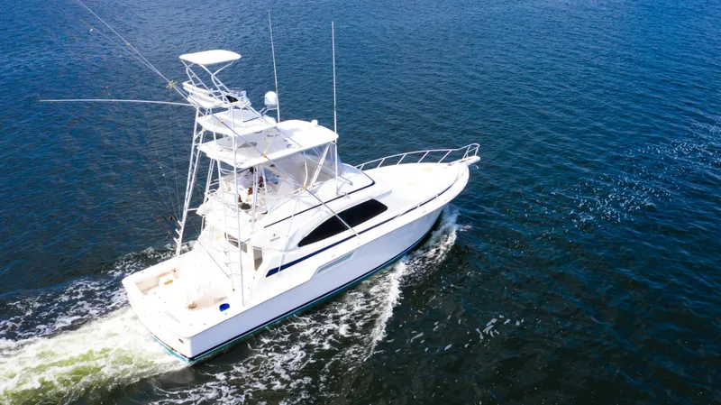 The Image of 2005 Bertram 450 Convertible yacht cruising on open water. - 0