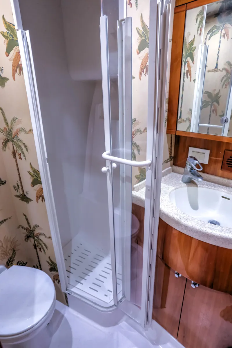 Slide: The Image of Bathroom interior of 2005 Bertram 450 Convertible yacht with shower and sink. - 12