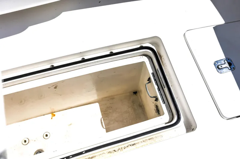 Slide: The Image of Open storage compartment on a 2005 Bertram 450 Convertible boat. - 42