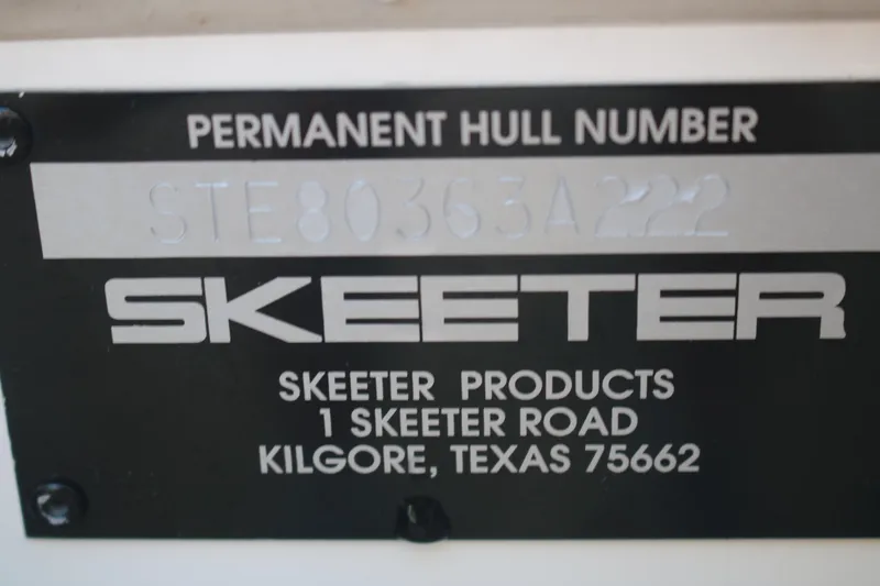Slide: The Image of Alt text: "Skeeter SX2250 2022 hull number plate, Kilgore, Texas address." - 14