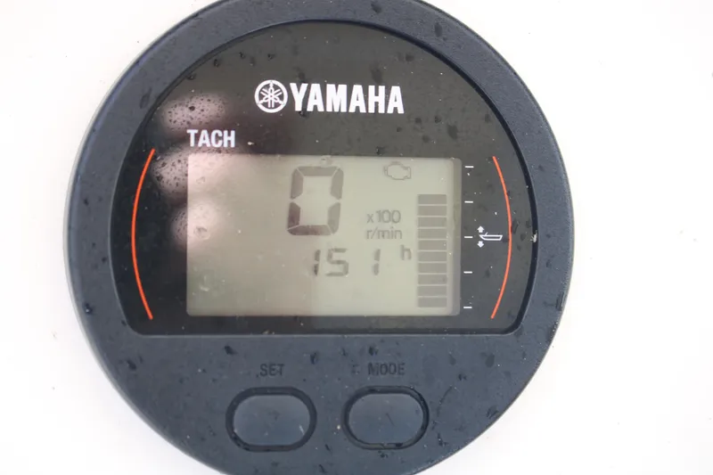 Slide: The Image of Yamaha tachometer displaying 151 hours on a 2022 Skeeter SX2250 boat. - 17