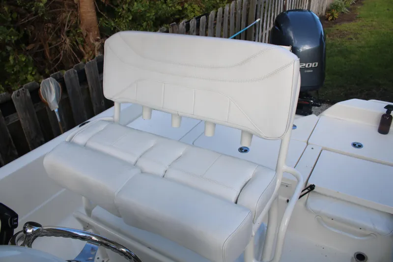 Slide: The Image of 2022 Skeeter SX2250 boat with white cushioned seating and Yamaha 200 outboard motor. - 21