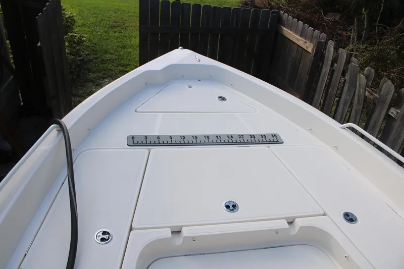 Slide: The Image of 2022 Skeeter SX2250 boat deck with storage compartments and measuring ruler. - 22