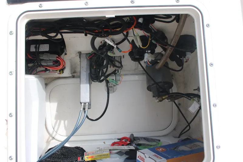 Slide: The Image of 2022 Skeeter SX2250 boat compartment with wiring and equipment. - 23