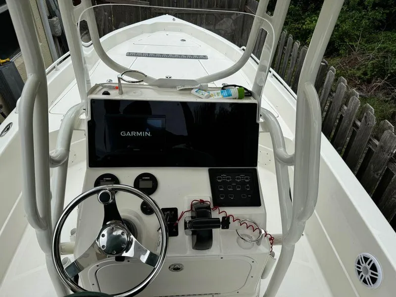Slide: The Image of 2022 Skeeter SX2250 boat console with Garmin navigation system and steering wheel. - 8