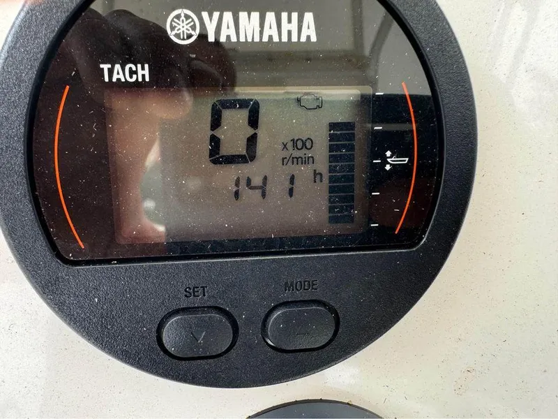 Slide: The Image of Yamaha tachometer displaying 141 hours on a 2022 Skeeter SX2250 boat. - 9