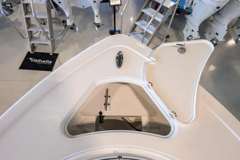 Slide: The Image of 2024 Sportsman Open 252 Center Console boat with open storage compartment. - 10