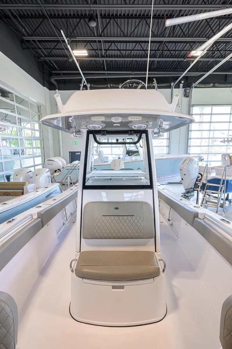 Slide: The Image of 2024 Sportsman Open 252 Center Console boat interior with seating and modern design. - 12