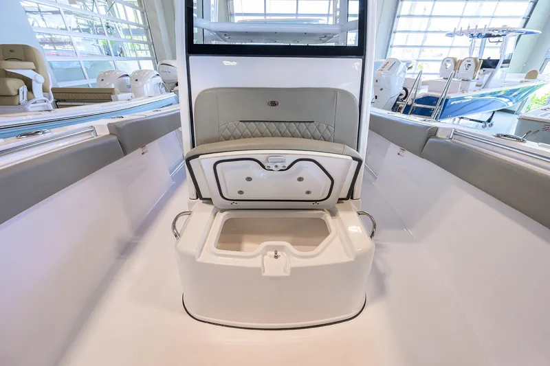 Slide: The Image of 2024 Sportsman Open 252 Center Console boat interior with open storage compartment. - 13