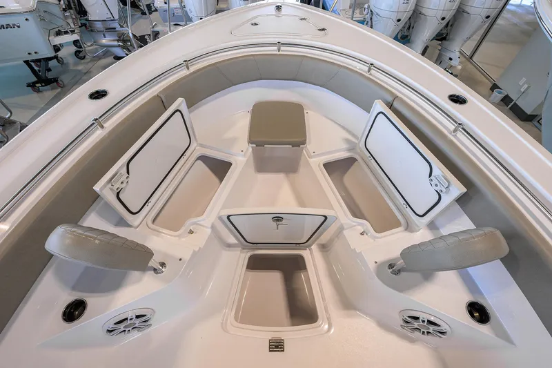 Slide: The Image of 2024 Sportsman Open 252 Center Console boat interior with storage compartments open. - 14