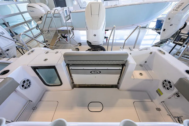 Slide: The Image of 2024 Sportsman Open 252 Center Console boat interior with seating and storage. - 16