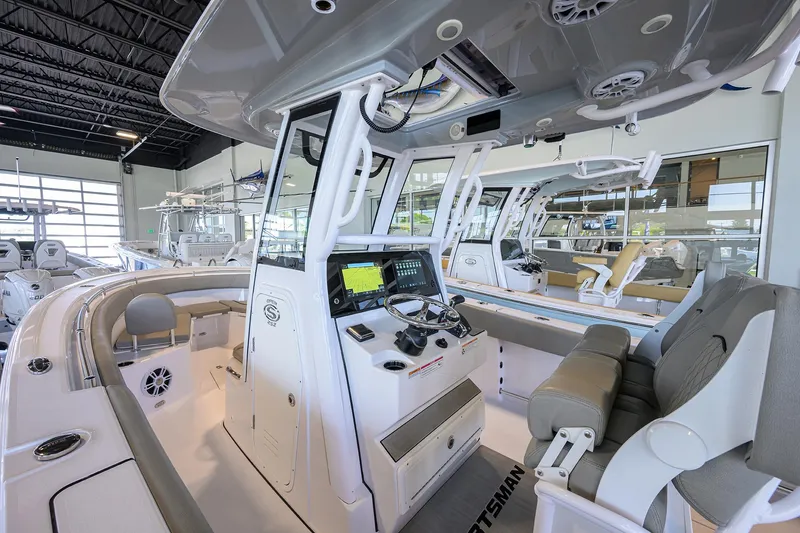 Slide: The Image of 2024 Sportsman Open 252 Center Console boat interior with modern navigation equipment. - 24