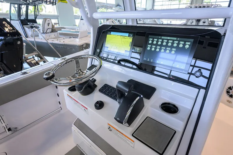 Slide: The Image of 2024 Sportsman Open 252 Center Console dashboard with modern navigation and control systems. - 25