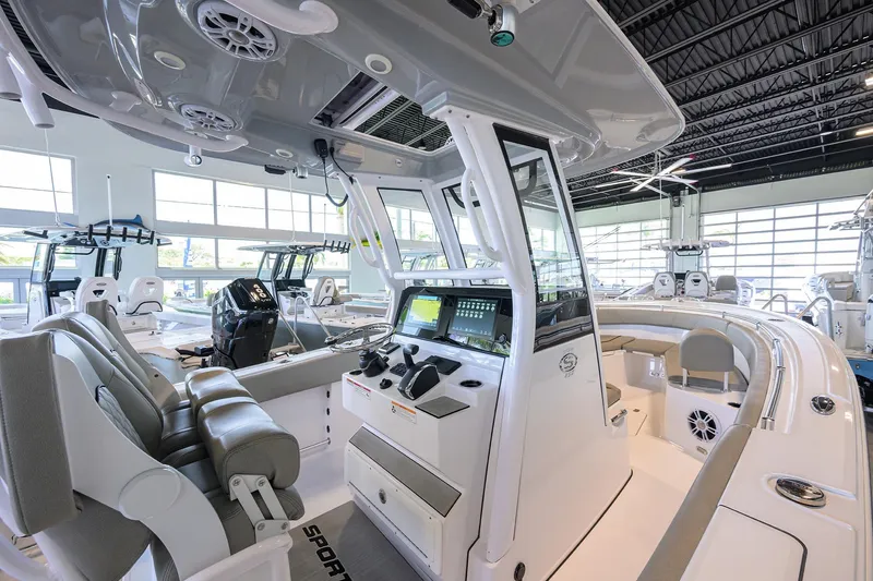 Slide: The Image of 2024 Sportsman Open 252 Center Console boat interior in showroom. - 26