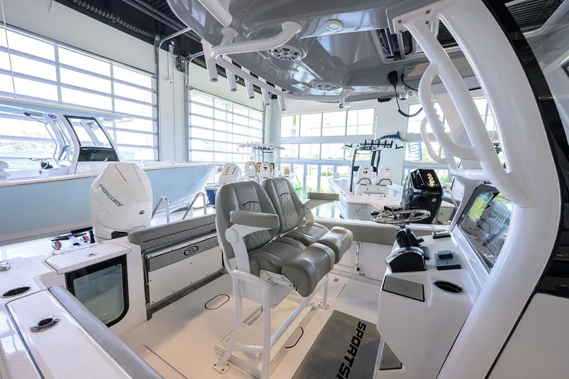 Slide: The Image of 2024 Sportsman Open 252 Center Console boat interior with modern seating and controls. - 27