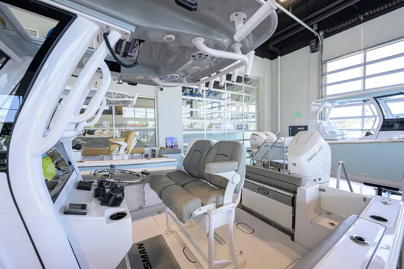 Slide: The Image of 2024 Sportsman Open 252 Center Console boat interior with modern seating and controls. - 28