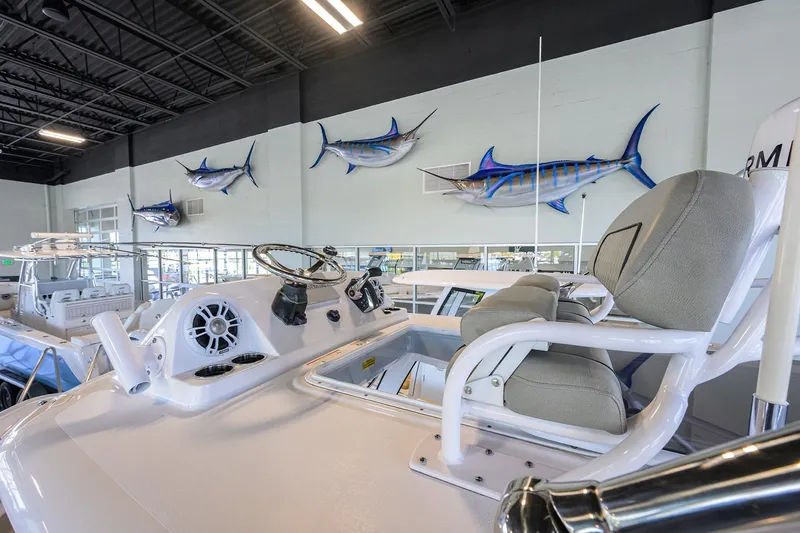 Slide: The Image of 2024 Sportsman Open 252 Center Console interior with mounted marlin fish decor. - 29