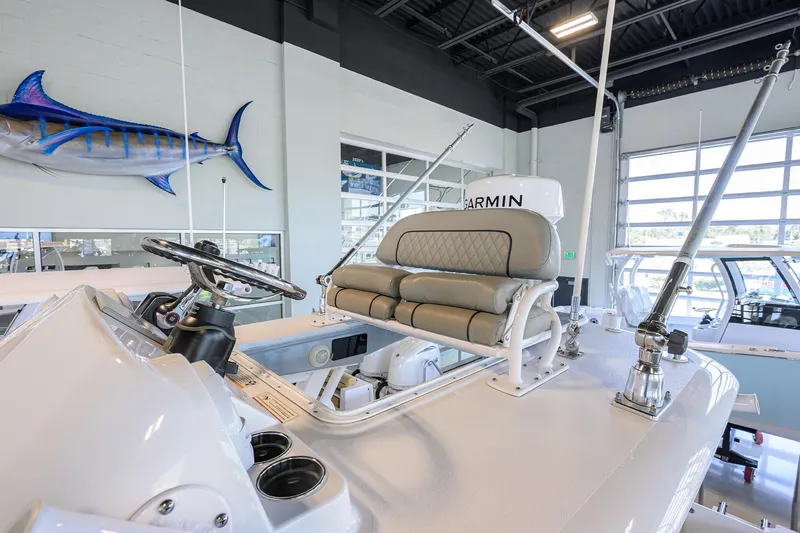 Slide: The Image of 2024 Sportsman Open 252 Center Console boat interior with helm and seating. - 30