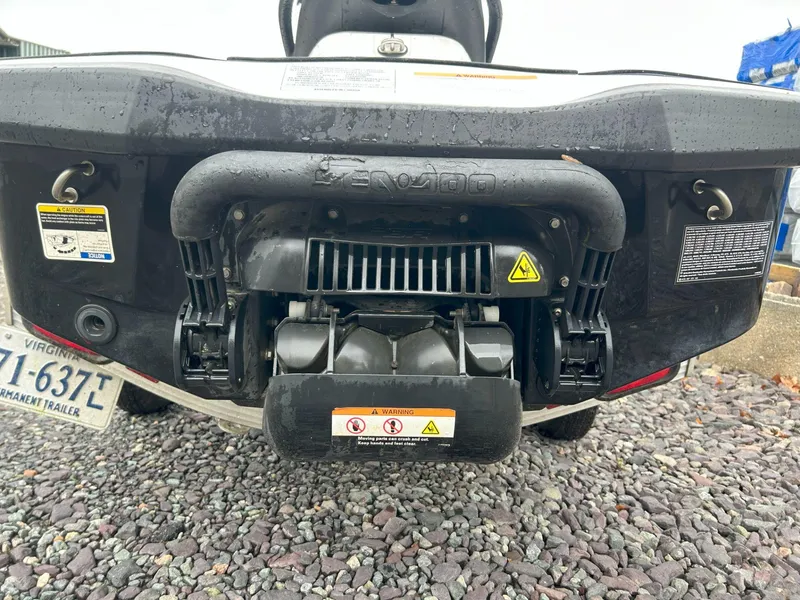 Slide: The Image of Rear view of a 2012 Sea-Doo GTX 155 jet ski on gravel surface. - 18